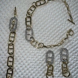 Emma Pills gold necklace, bracelet and earring set